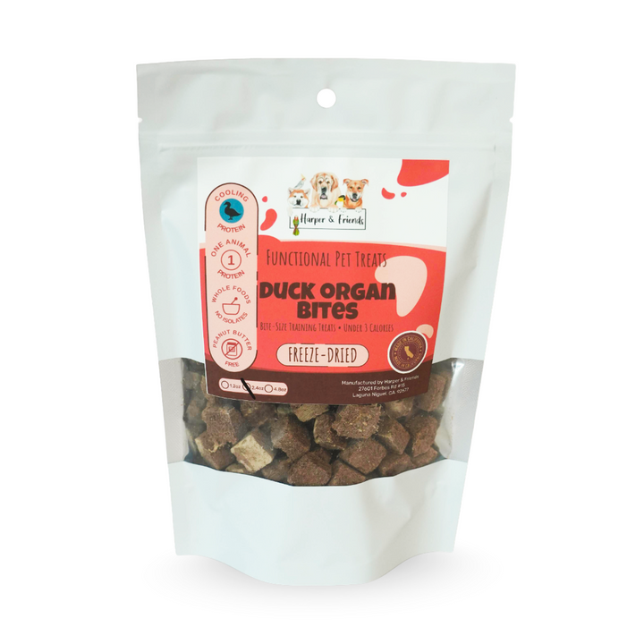 A stand-up pouch of Harper &amp; Friends brand Functional Pet Treats Duck Organ Bites, freeze-dried, with the treats visible through a clear window on a white background.