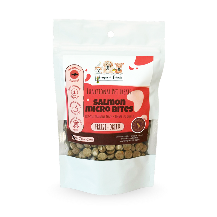 A stand-up pouch of Harper &amp; Friends Salmon Micro Bites freeze-dried pet treats, featuring a white and orange label with a clear window showing the freeze-dried round shaped treats inside.